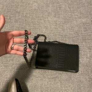 Black wallet on a chain